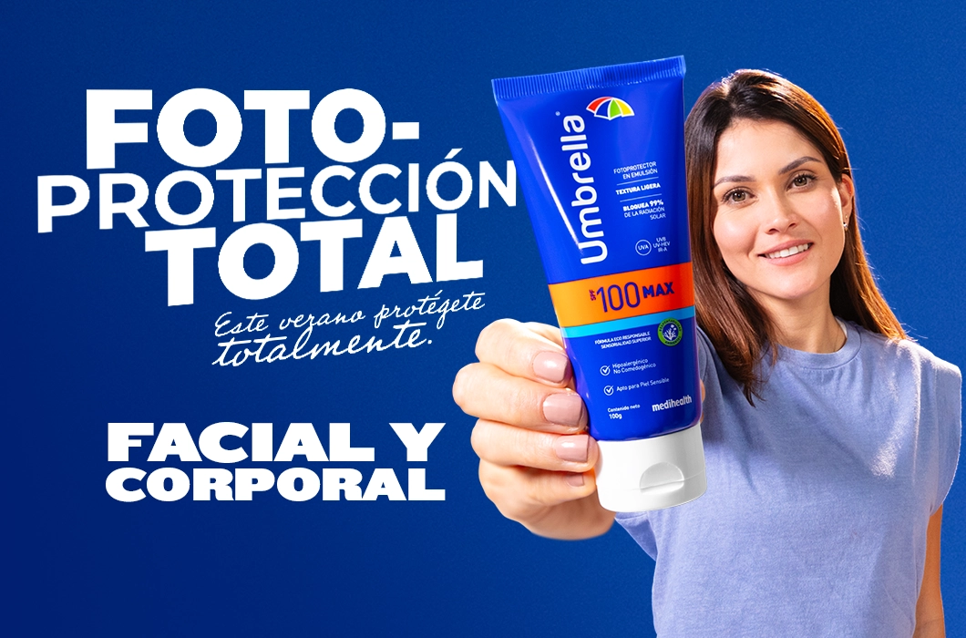Mujer sonriente sostiene protector solar Umbrella Max SPF 100 en primer plano, con fondo azul y texto ‘Fotoprotección total. Este verano protégente totalmente. Facial y corporal’.