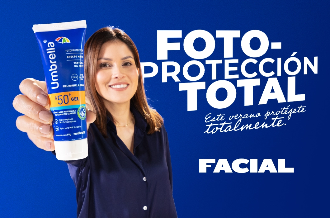 Mujer sonriendo sostiene protector solar Umbrella Gel SPF 50+ en primer plano, sobre fondo azul con el mensaje ‘Fotoprotección total. Este verano protégente totalmente. Facial’.